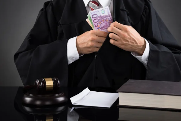 Judge Hiding Banknotes At Desk — Stock Photo, Image