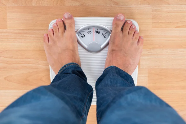 Man Standing On Weighing Scale — Stock Photo, Image