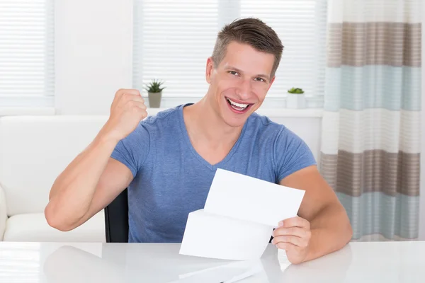 Man With Document At Desk — Stock Photo, Image