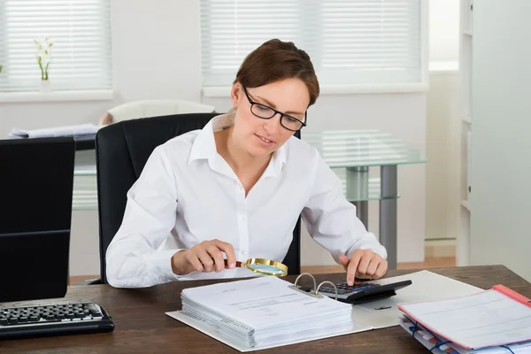 Businesswoman Checking Invoice — Stock Photo, Image