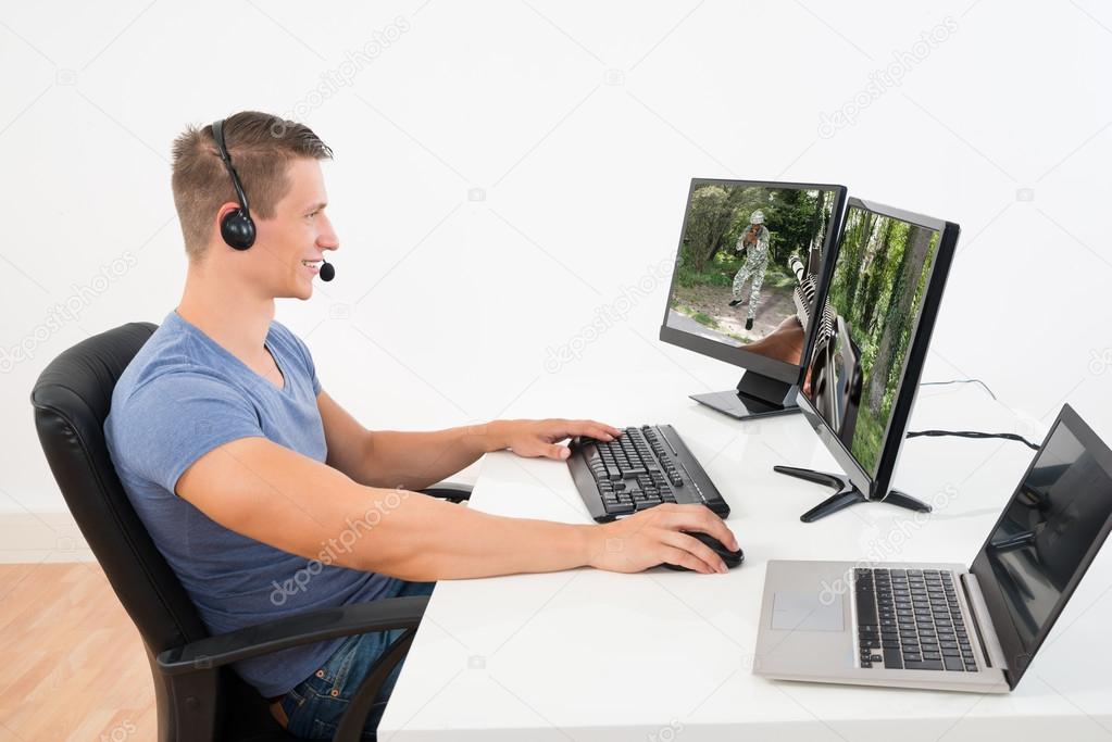 Man Playing Game On Computer