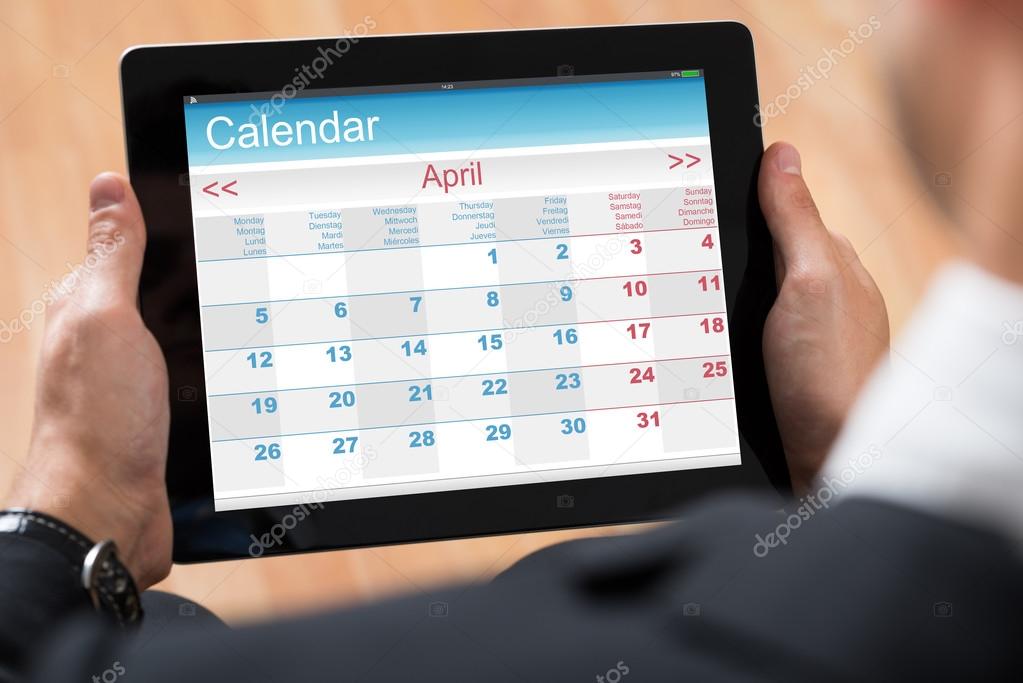 Businessperson Looking At Calendar