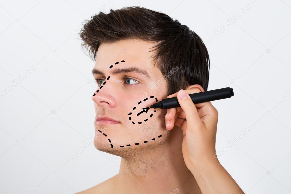 Person Hands Drawing Correction Lines On Face
