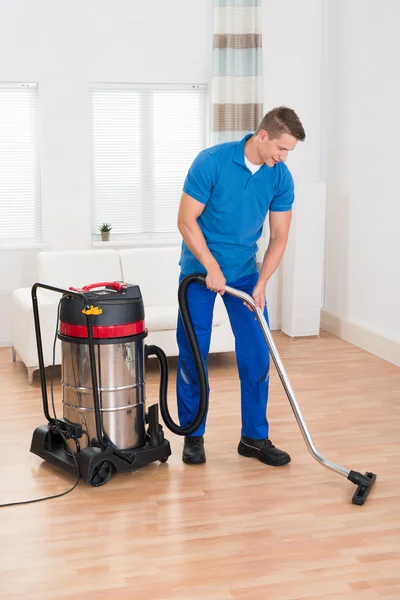 Male Janitor Vacuuming Floor — Stock Photo, Image