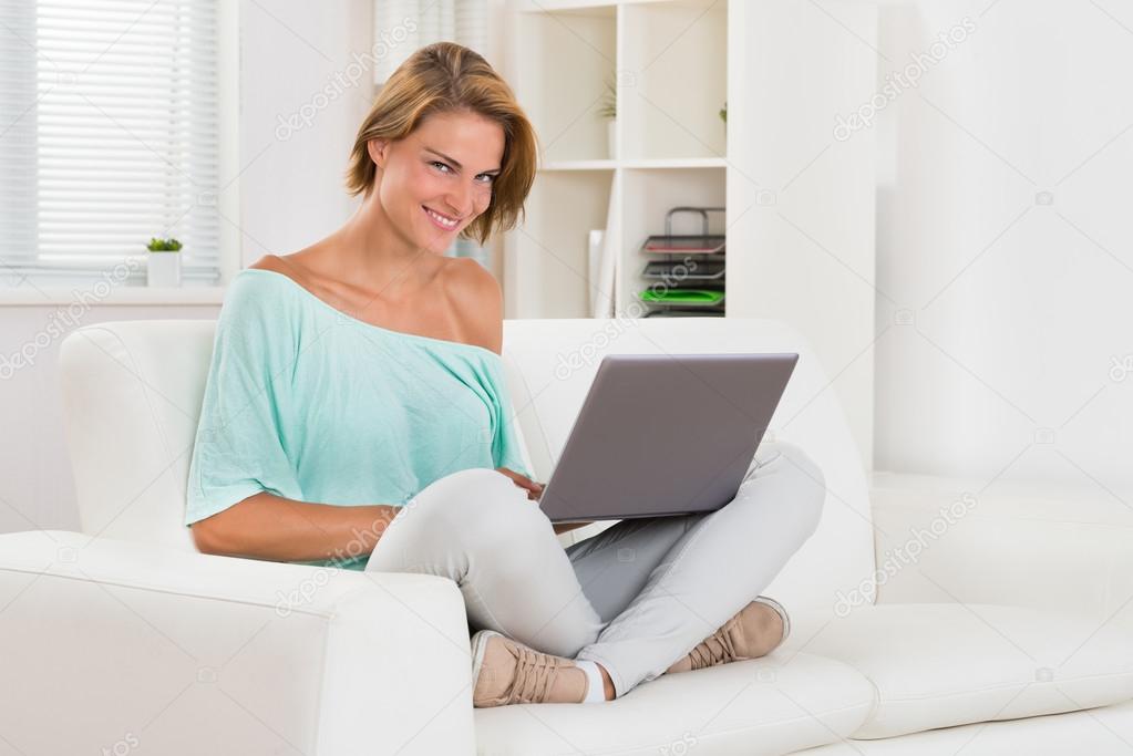 Happy Woman Using Laptop