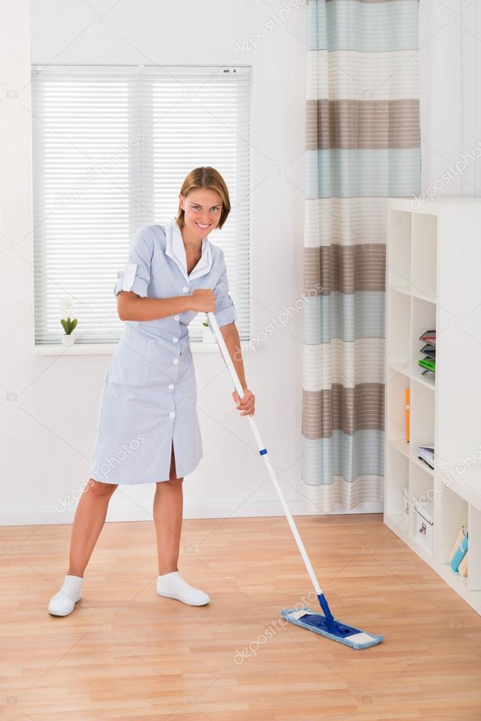 Female Janitor Mopping Floor