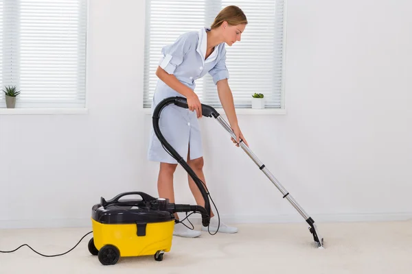 Female Maid Cleaning With Vacuum Cleaner — Stock Photo, Image