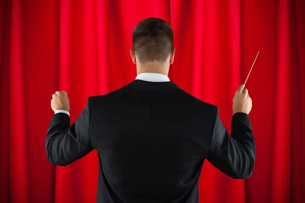 Orkest dirigent routeren dirigeerstok — Stockfoto