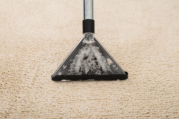 Vacuum Cleaner Over Carpet With Foam — Stok Foto