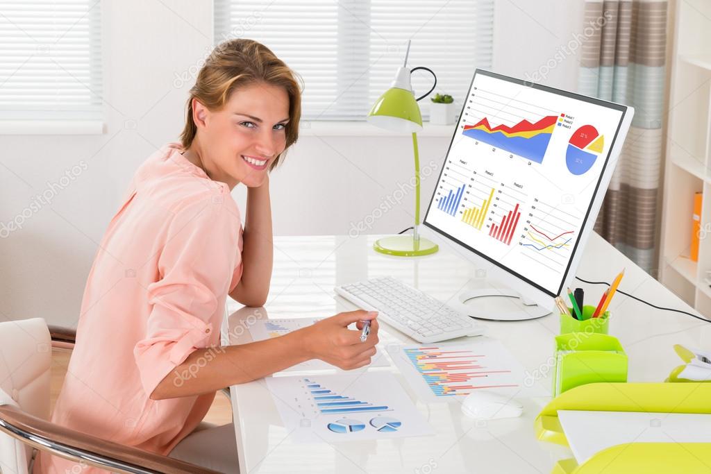 Woman Analyzing Financial Graphs