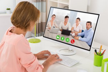 Woman Videoconferencing On Computer clipart