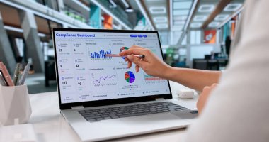 Monitoring Data Security Regulations, Legal Compliance Officer Inspects Information On Laptop.