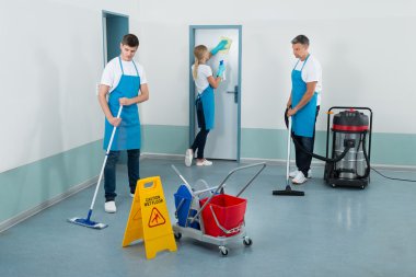 Janitors Cleaning Corridor clipart