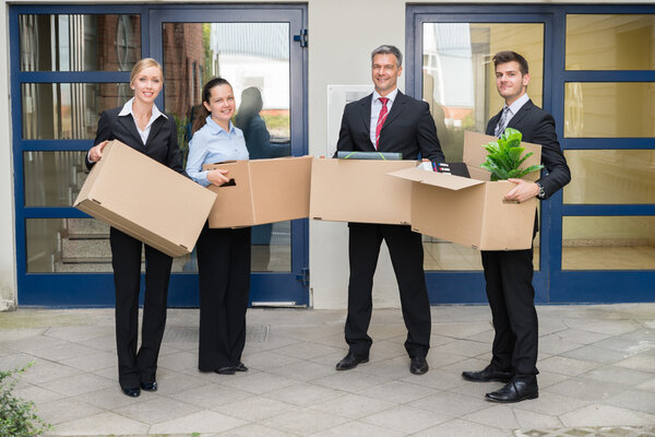 Businesspeople With Cardboard Boxes