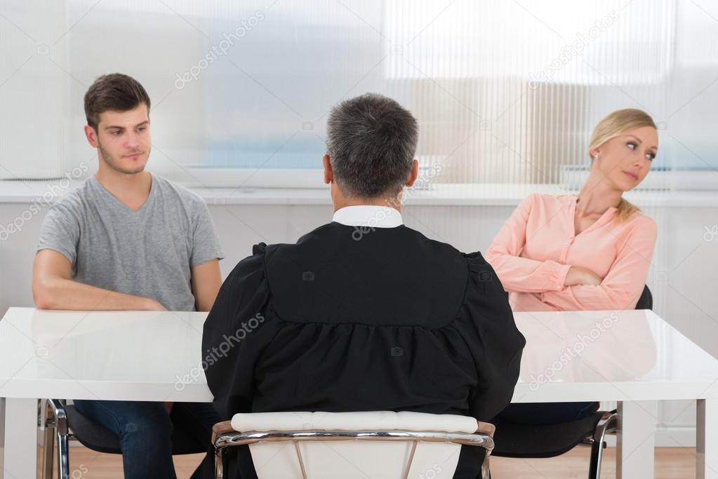 Judge In Front Of A Unhappy Couple