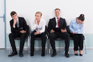 Businesspeople Waiting For Job Interview clipart