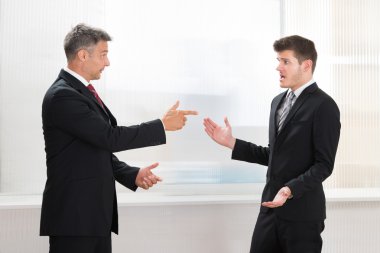 Two Businessmen Quarreling clipart