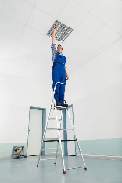 Electrician Installing Ceiling Light — Stock Photo, Image