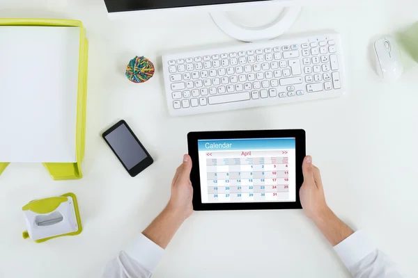 Businessperson With Digital Tablet Showing Calendar — Stock Photo, Image