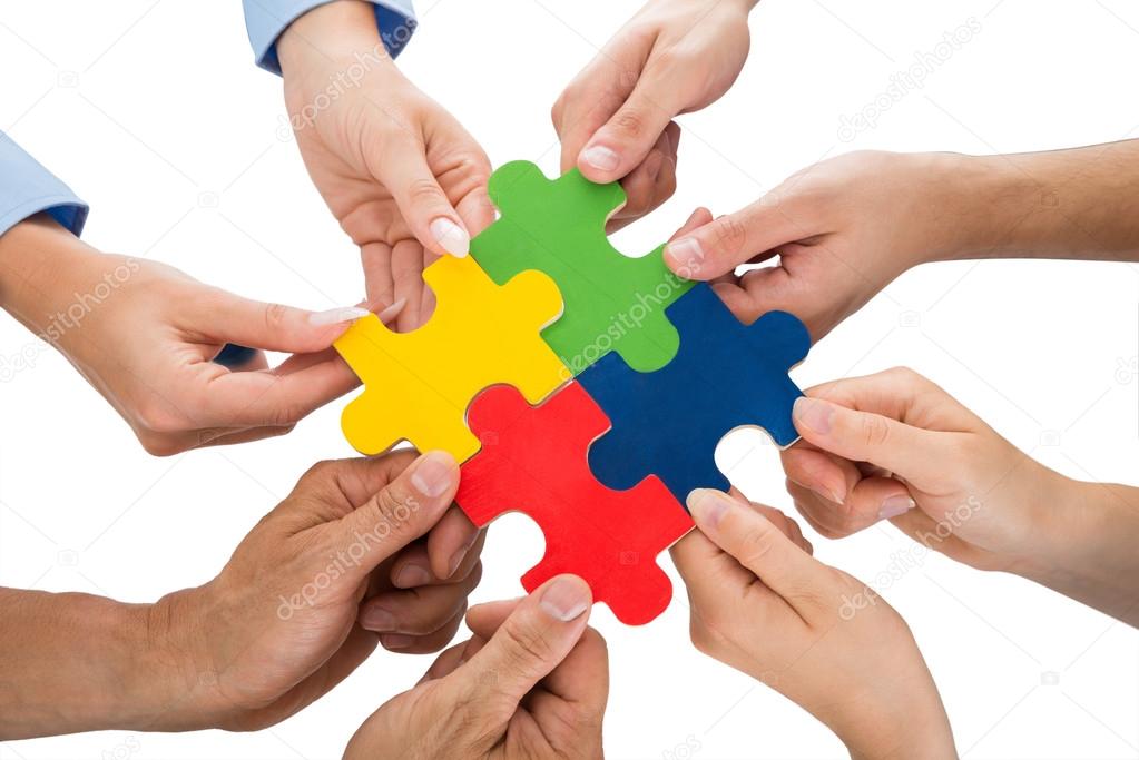 People Hands Connecting Jigsaw Pieces