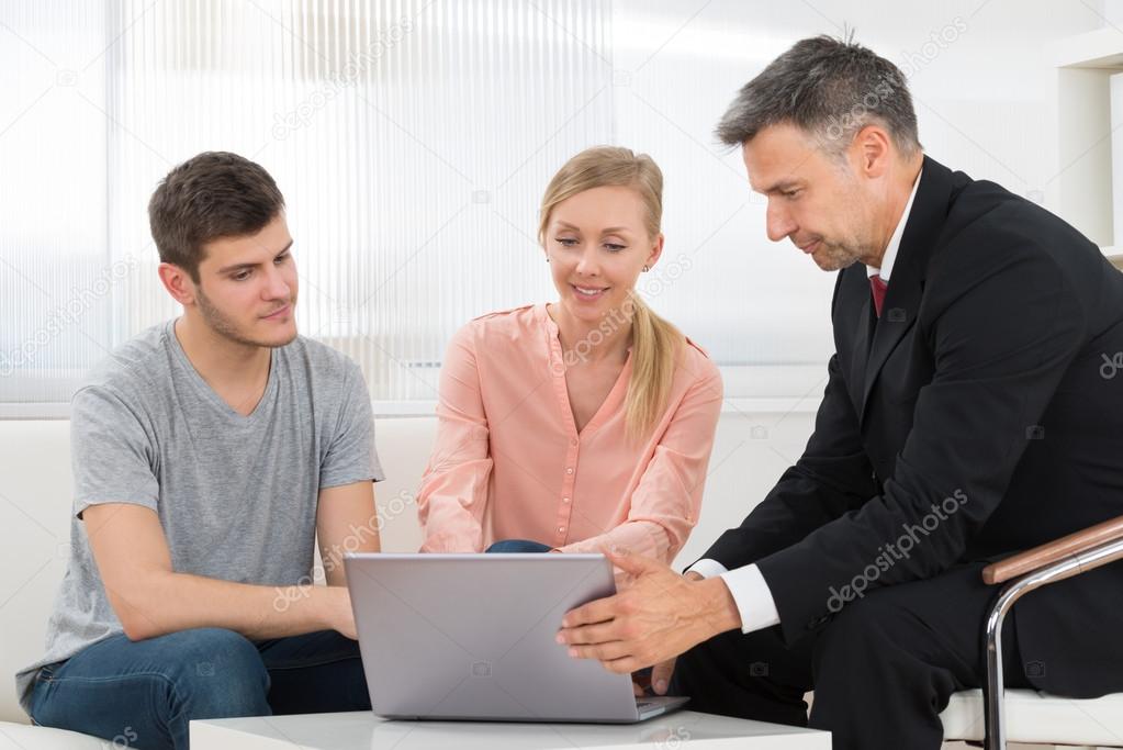 Consultant Explaining Investment Plan To Couple