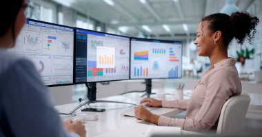 Top African American Business Coach Analyzing Data On Computer