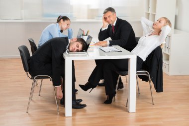 Businesspeople Getting Bored In Office clipart