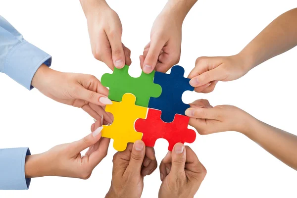 People Hands Holding Jigsaw Pieces — Stock Photo, Image