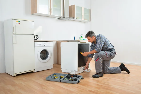 Technician Checking Dishwasher With Digital Multimeter — Stock Photo, Image