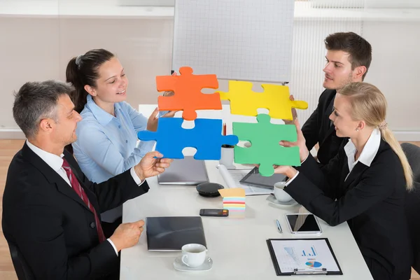 Businesspeople Joining Puzzle Piece — Stock Photo, Image