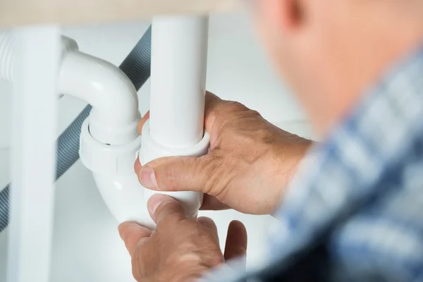 Working On Pipes Under Kitchen Sink — Stock Photo, Image