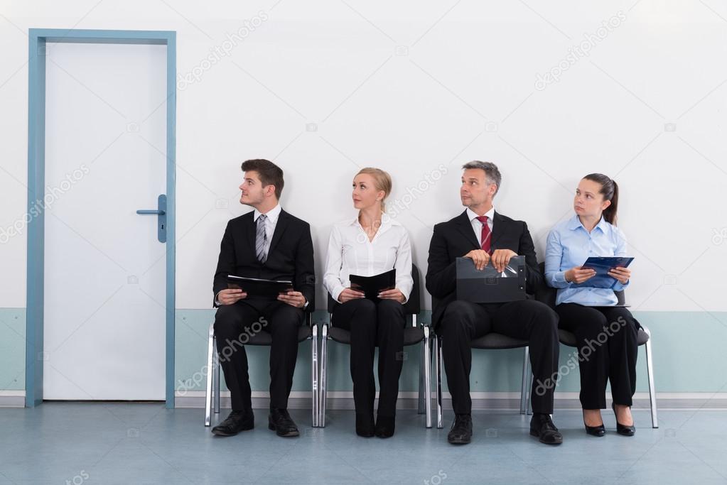 Businesspeople Sitting On Chair