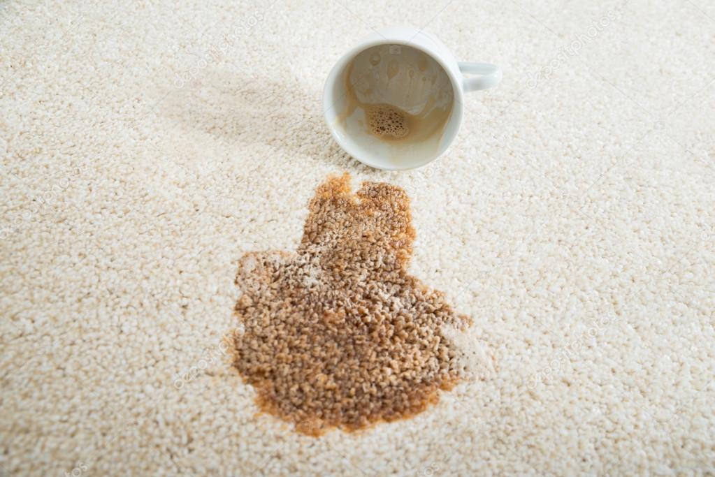 Coffee Spilling From Cup On Carpet