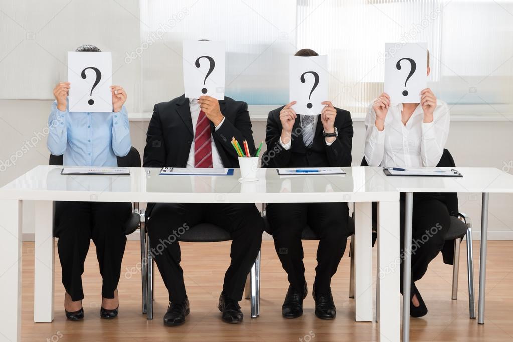 Businesspeople Hiding Face With Question Mark