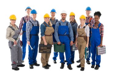 Portrait Of Confident Carpenters Carrying Toolboxes clipart