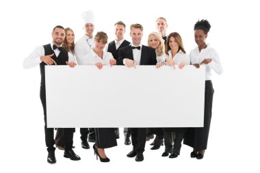 Restaurant Staff Holding Blank Billboard clipart