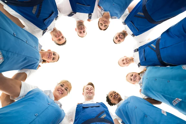 Confident Janitors Standing In Huddle — Stock Photo, Image