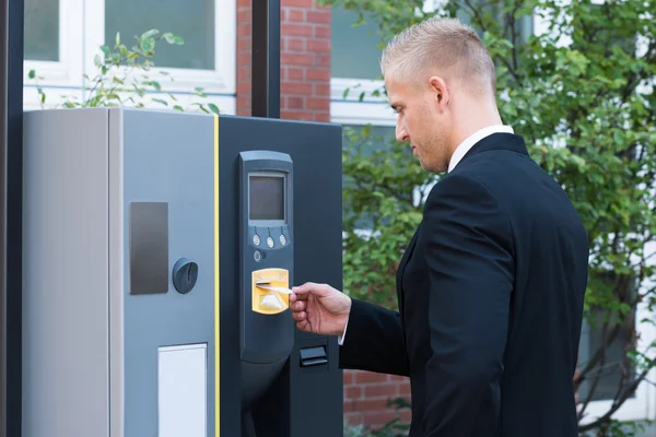 Man Inserting Ticket To Pay For Parking — Stock Photo, Image
