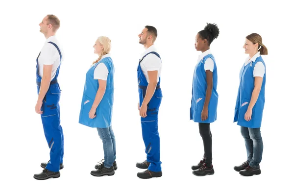Janitores multiétnicos em fila — Fotografia de Stock