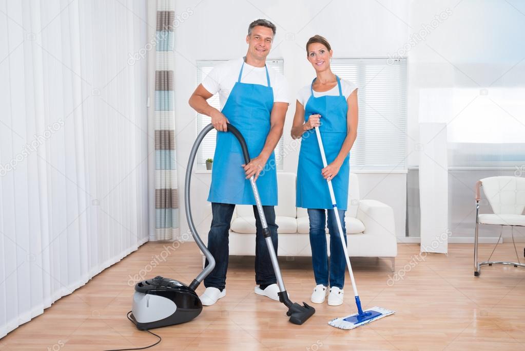 Two Janitors With Vacuum Cleaner And Mop