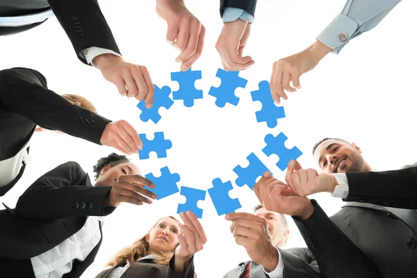 Business Team Joining Jigsaw Pieces — Stock Photo, Image