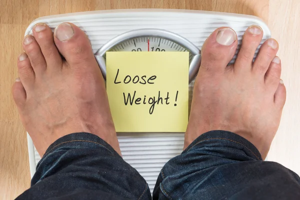 Man Standing On Weight Scale — Stock Photo, Image