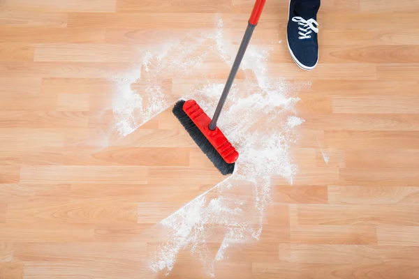 Man Sweeping Hardwood Floor — Stock Photo, Image