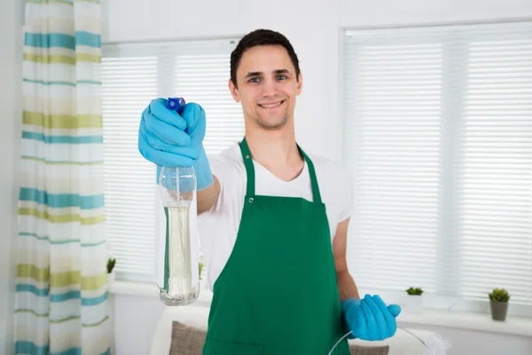 Smiling Cleaner Holding Spray Bottle — Stock Photo, Image