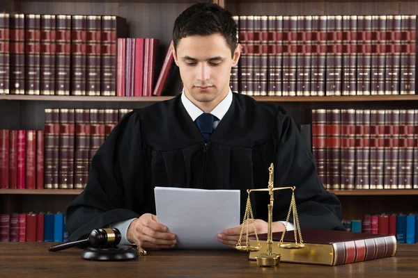 Judge Reading Documents At Desk — Stock Photo, Image