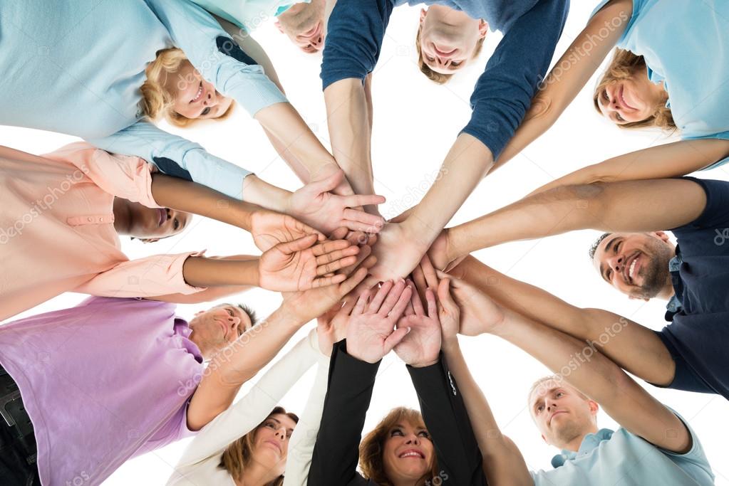 Business Team Stacking Hands In Huddle