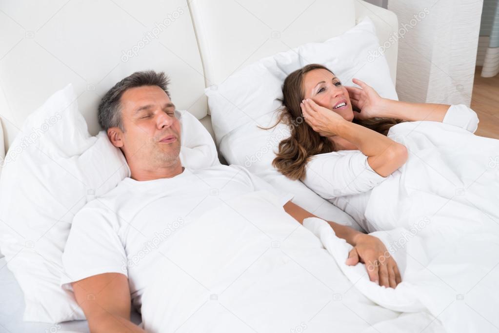 Woman Getting Disturbed With Man Snoring