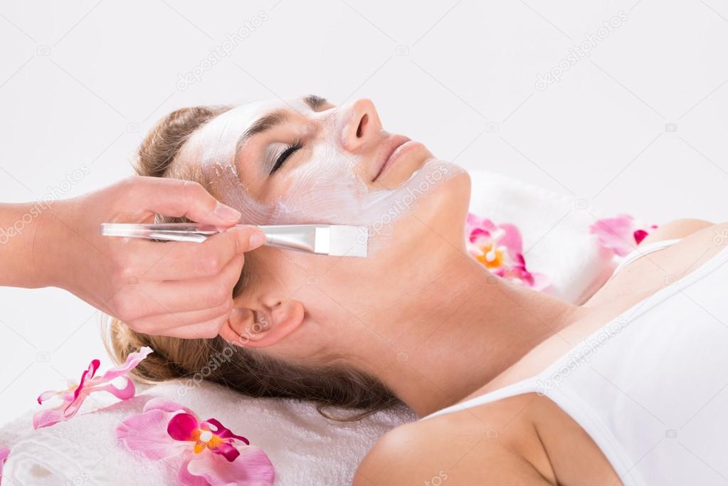 Applying Mask On Customer's Face