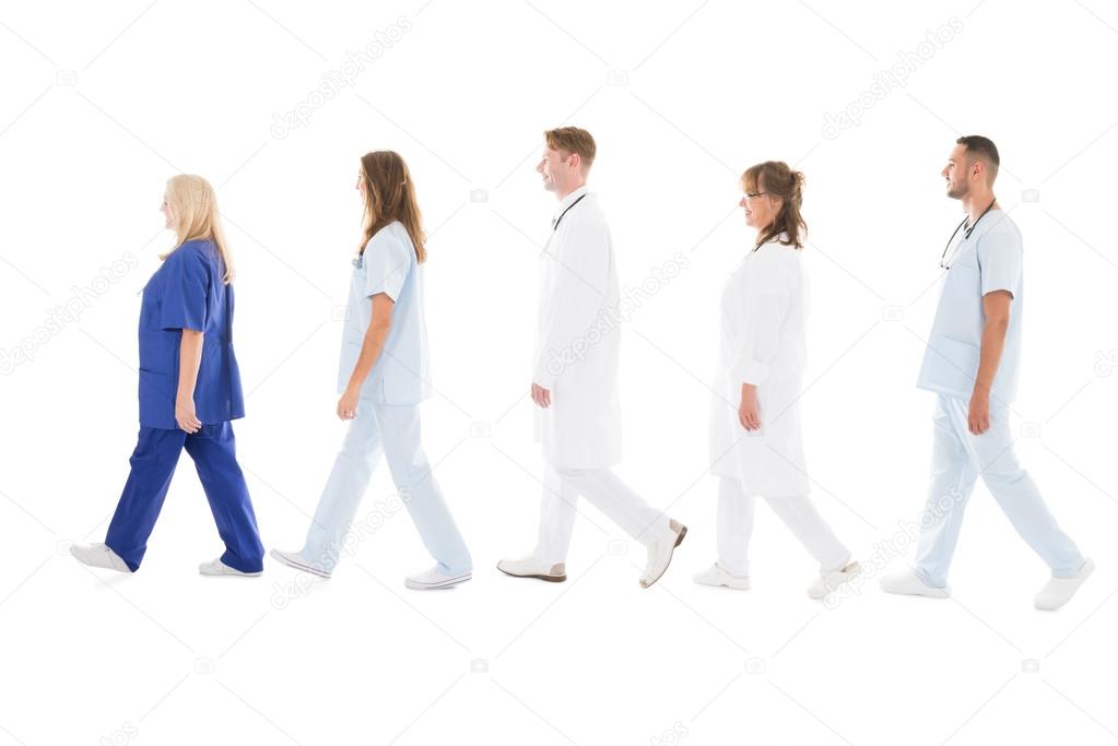 Medical Professionals Walking In Row