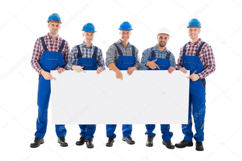 Construction Workers Holding Blank Billboard